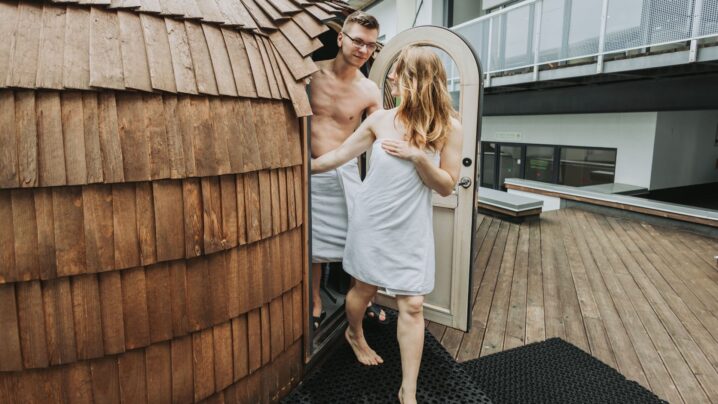 A young couple leaving the igloo sauna